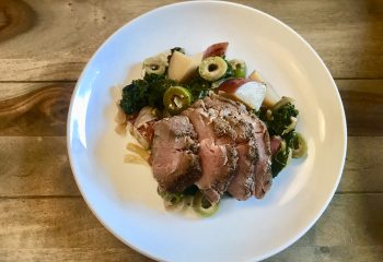 Seared Pork Tenderloin with Red Potatoes, Braised Kale, Lemon and Olives