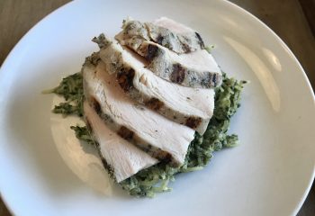 Herb Grilled Natural Chicken over Creamy Spaghetti Squash with Spinach, Basil, and Artichokes