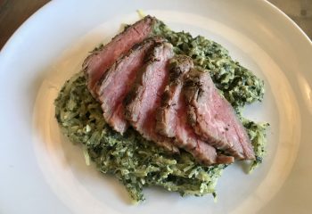 Grilled Natural Beef Tri Tip Steak over Creamy Spaghetti Squash with Spinach, Basil, and Artichoke