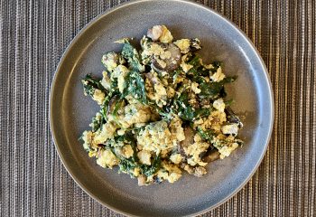 Cage Free Egg Scramble with House Made Bacon, Mushrooms & Spinach.